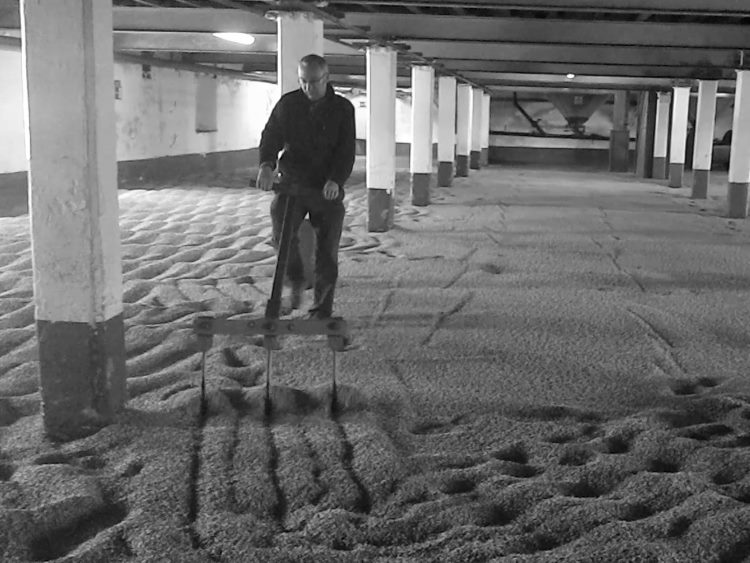 Paul Quin raking malt at Laphroaig Distillery, Islay